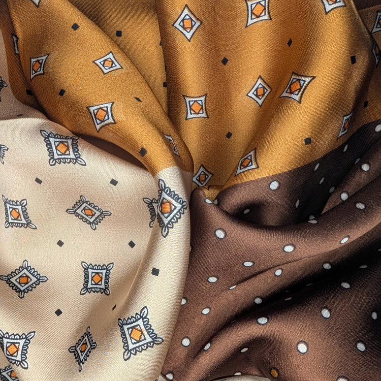 RecloStudio Halstuch Coffee Harmony mit Patchwork-Design in Braun-, Creme- und Kaffeetönen aus seidig-weichem Stoff.